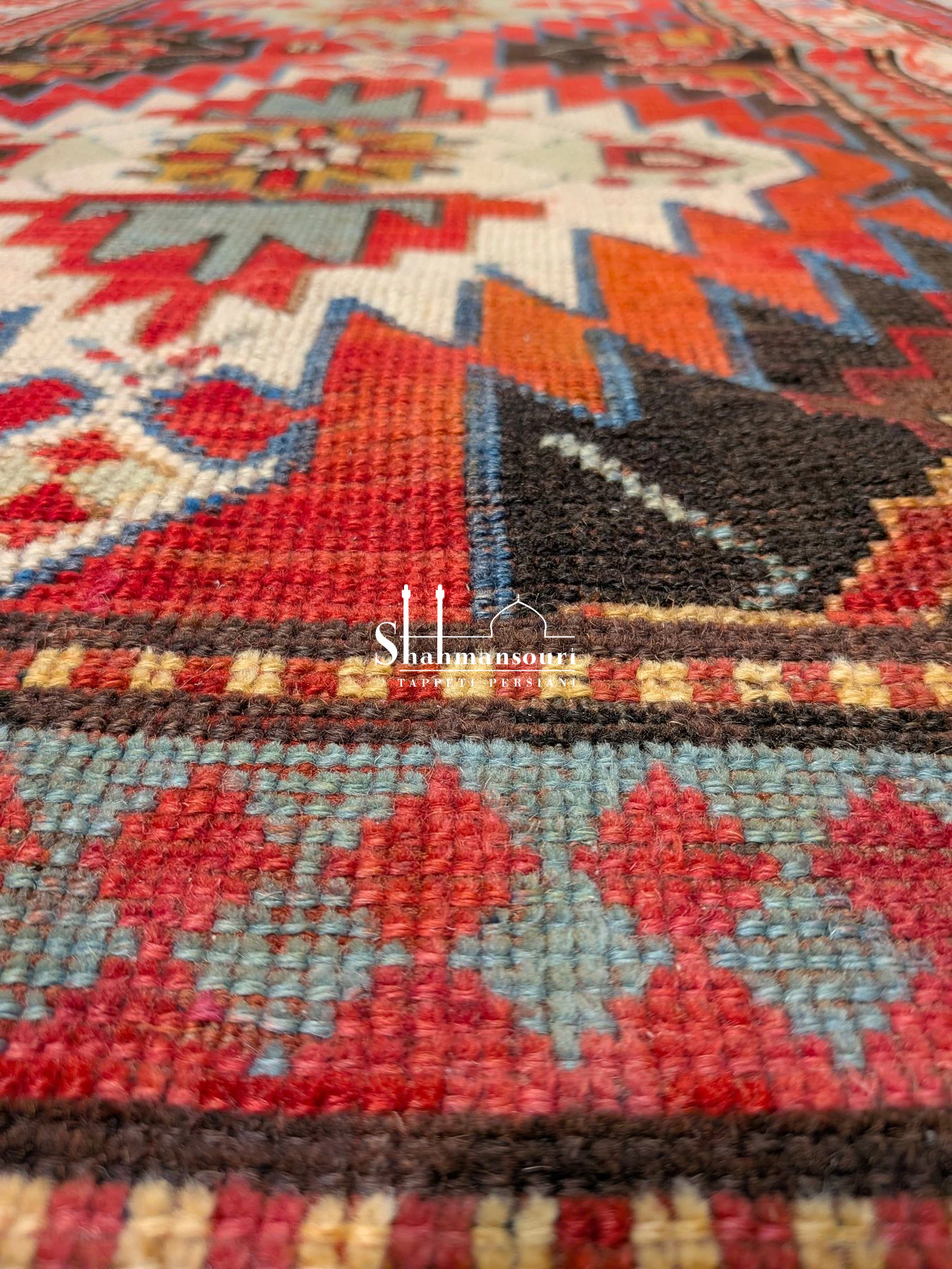Rectangular Kazak rug with two geometric medallions, multiple patterned borders and short fringes. - detail 2