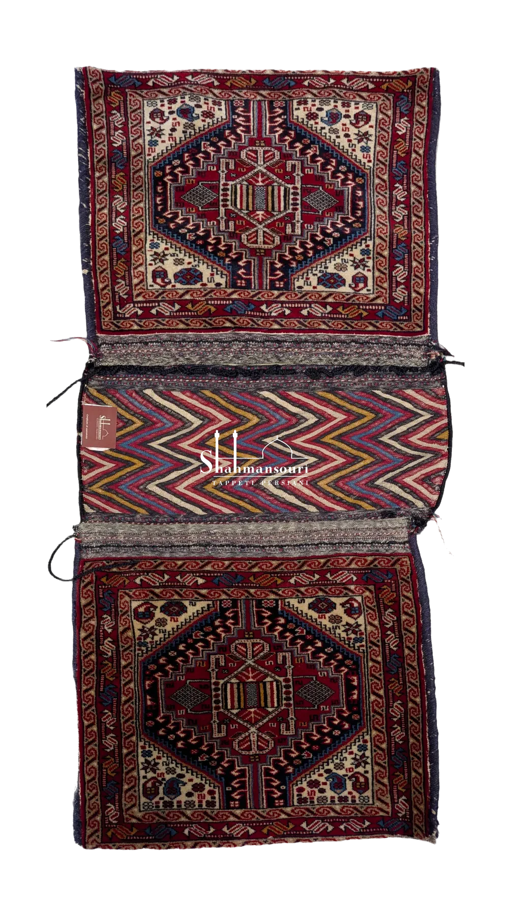 Open khorjin with two geometric medallion panels and a central multicoloured zigzag section.