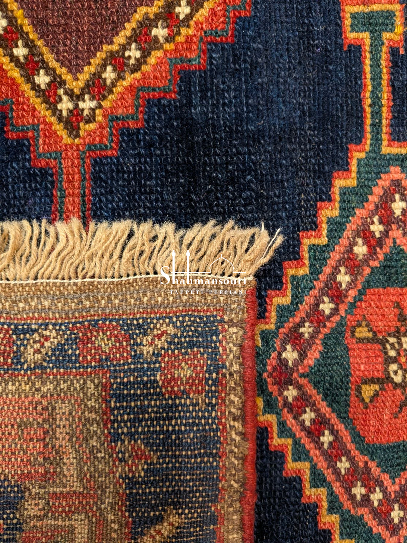Kordi Persian wool rug with a dark blue field, four geometric medallions, red borders and pale fringes, 182 x 128 cm. - detail 3