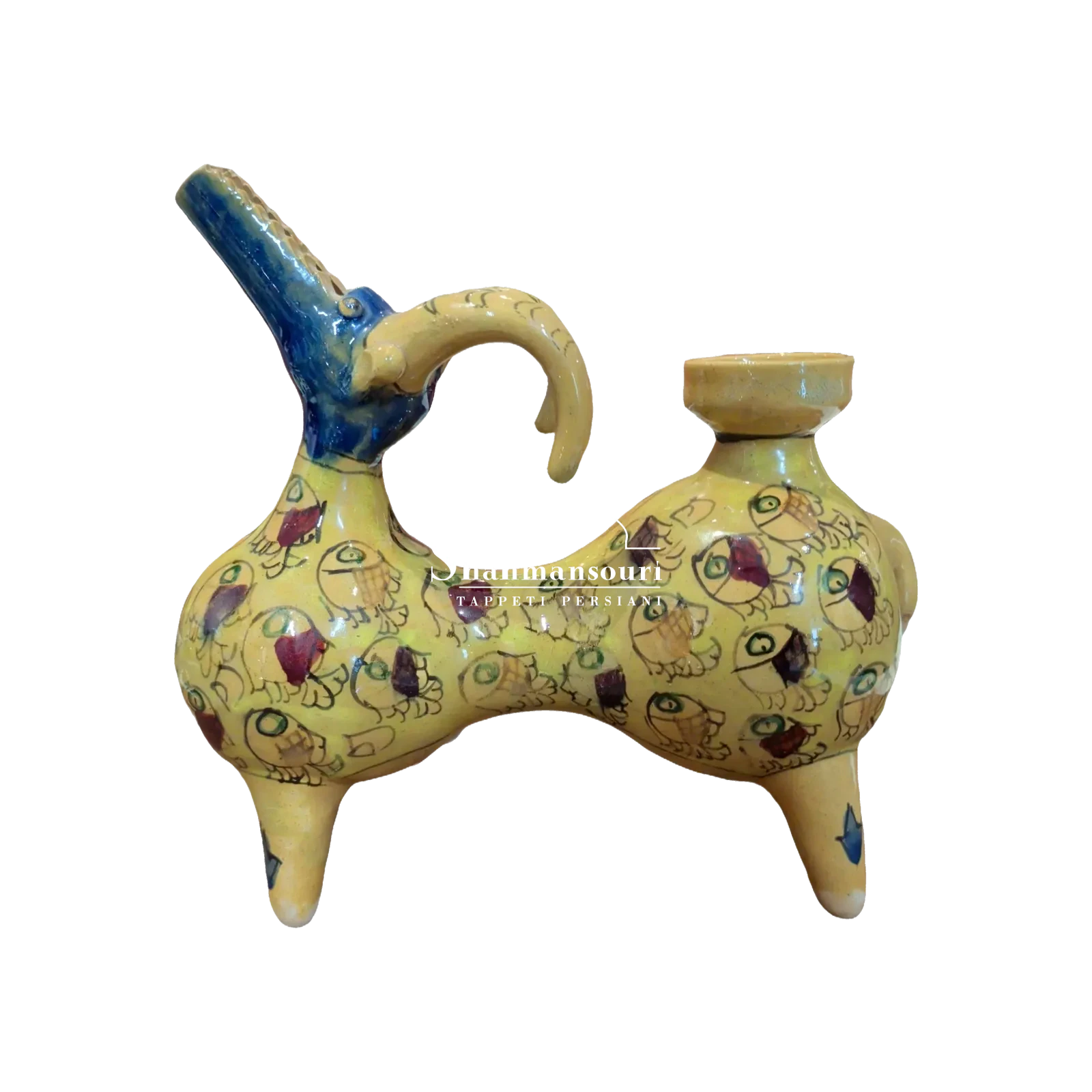Statua in maiolica con corpo giallo decorato da pesci, quattro zampe corte, testa blu dal muso allungato e corna gialle ricurve. - dettaglio 2