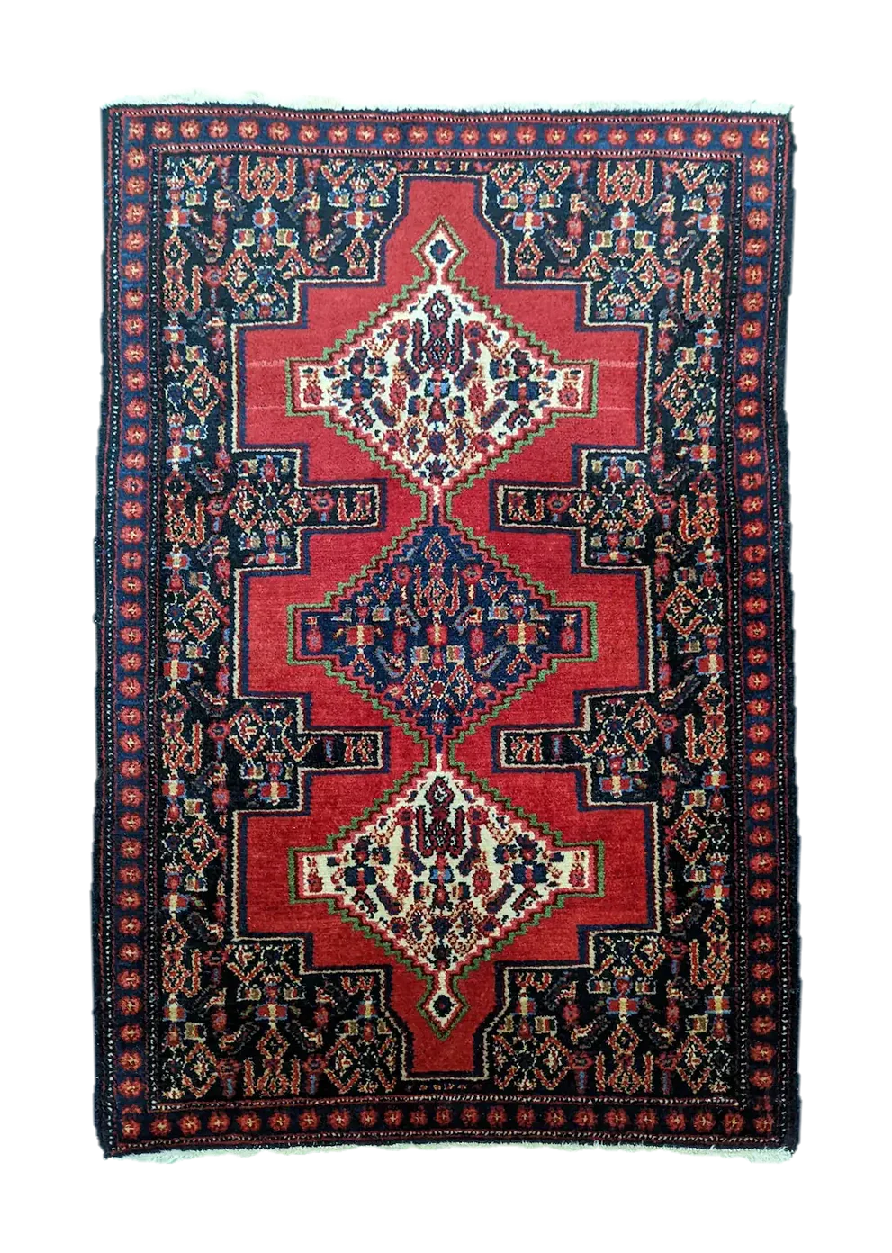 handmade Persian Senneh rug with geometric motifs and medallions on red background