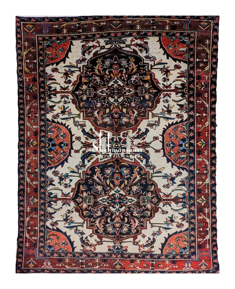 handmade Persian Baktiari rug with double medallion and floral motifs on light background