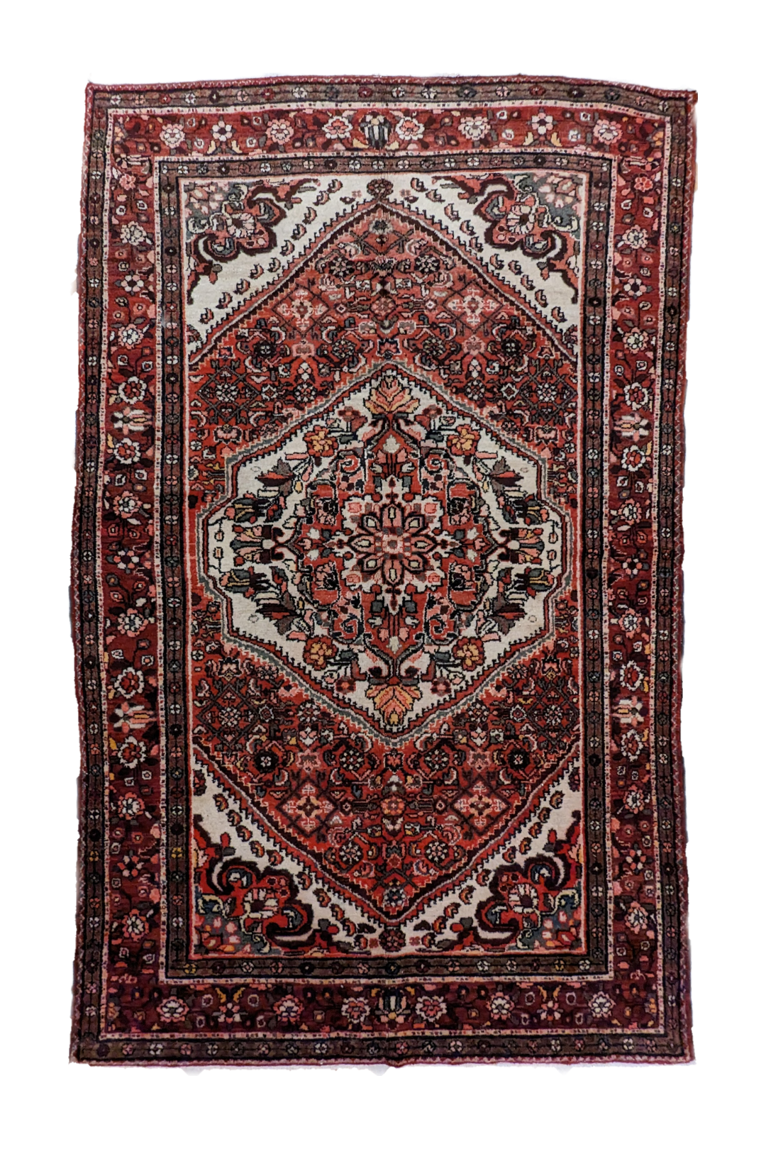 handmade Persian Hosseinabad rug with central medallion and floral motifs on red background