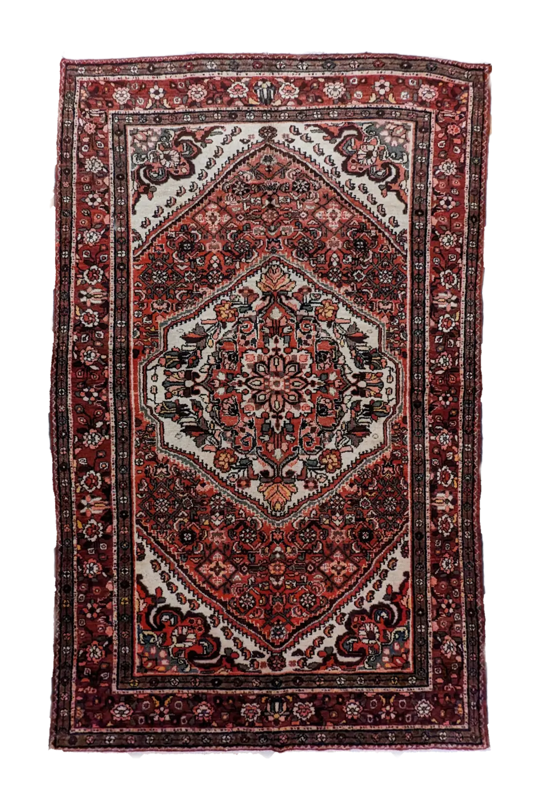 handmade Persian Hosseinabad rug with central medallion and floral motifs on red background