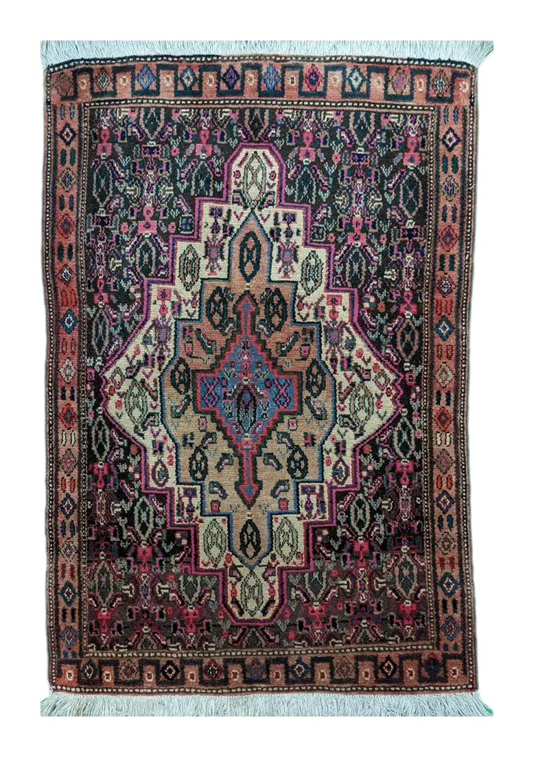 handmade Persian Senneh rug with geometric medallion on dark background