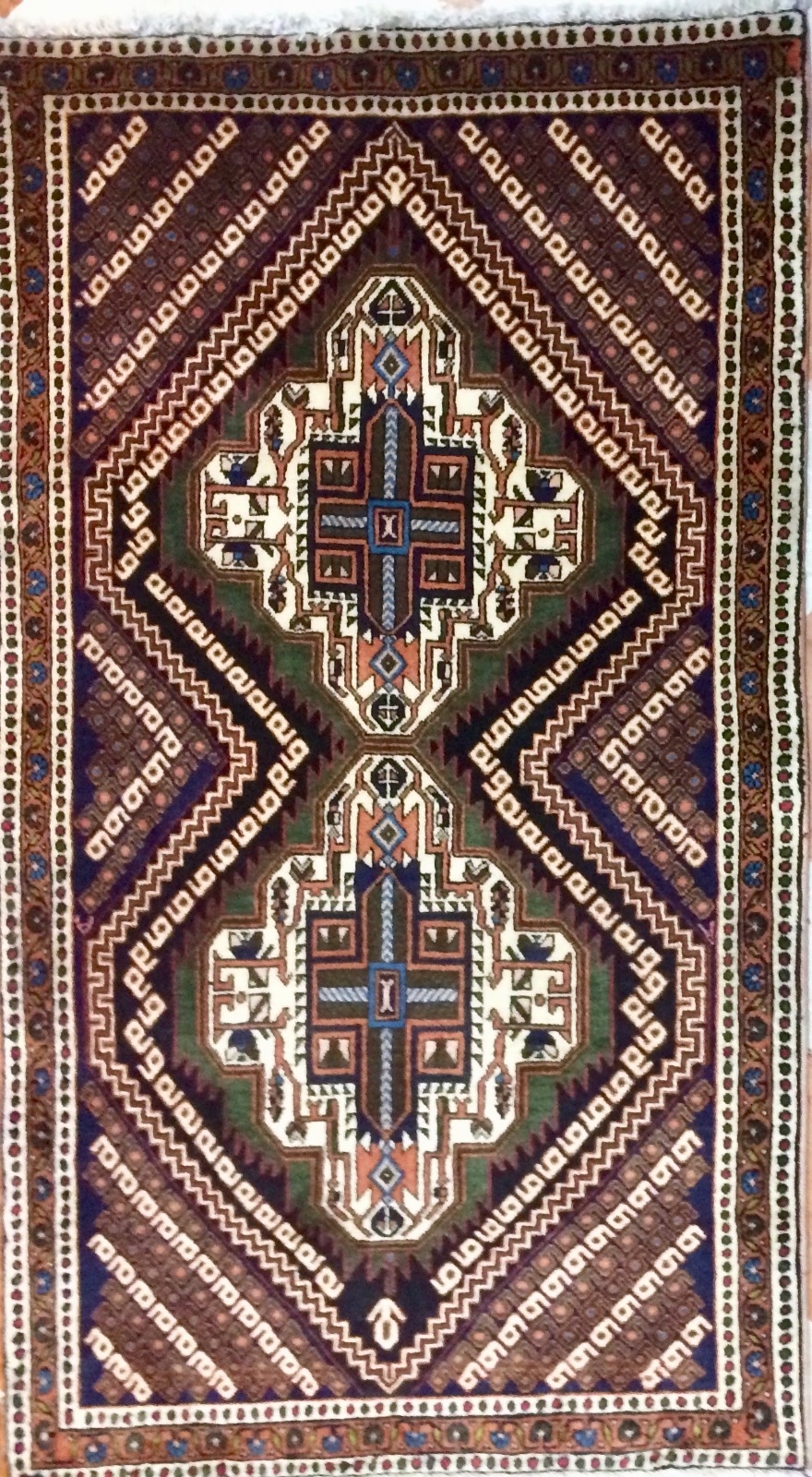 handmade Sirdjand Persian rug with tribal geometric medallions