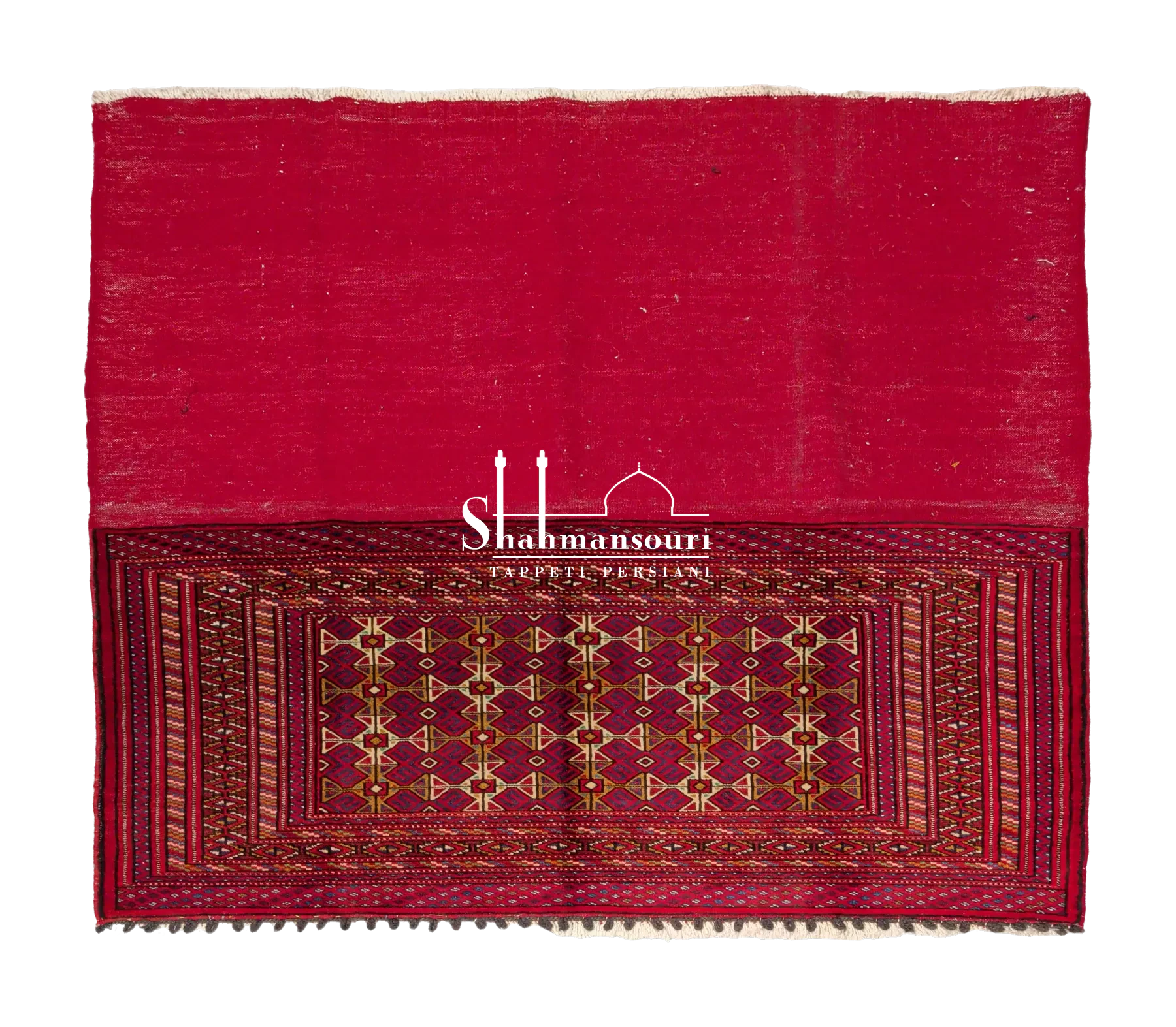 Manufatto turkmeno con ampia parte rossa e pannello geometrico rosso e scuro, dettagli avorio e ocra e bordure concentriche.