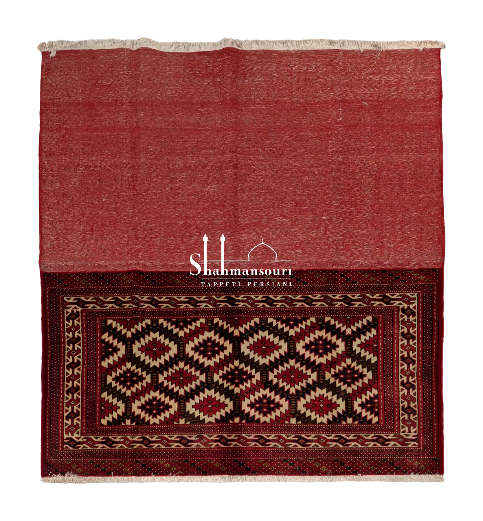 Turkmen textile with a broad plain red section, a panel of ivory serrated diamonds, star motifs and geometric borders.