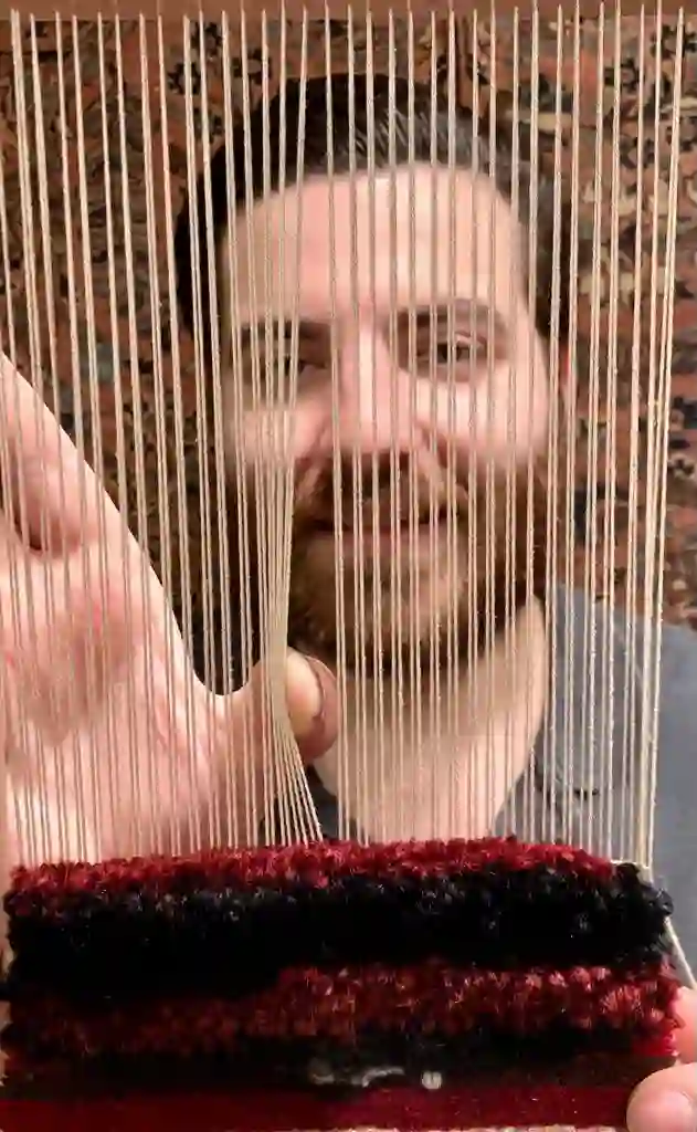 Dettaglio di tappeto persiano nel negozio Shahmansouri